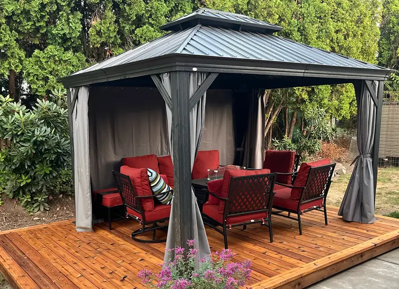 Cedar platform deck with a metal-roof gazebo and outdoor seating